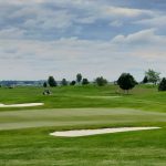 green grass with the flag in the hole.