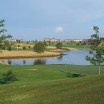 Panoramic view of a lush green golf course at The Ridge Golf Club. Smooth