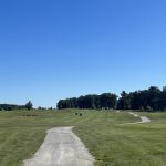 green grass with the flag in the hole.