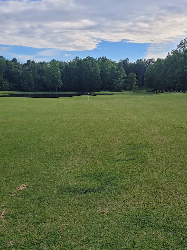 Panoramic view of a lush green golf course at The Ridges at Village Creek. Smooth