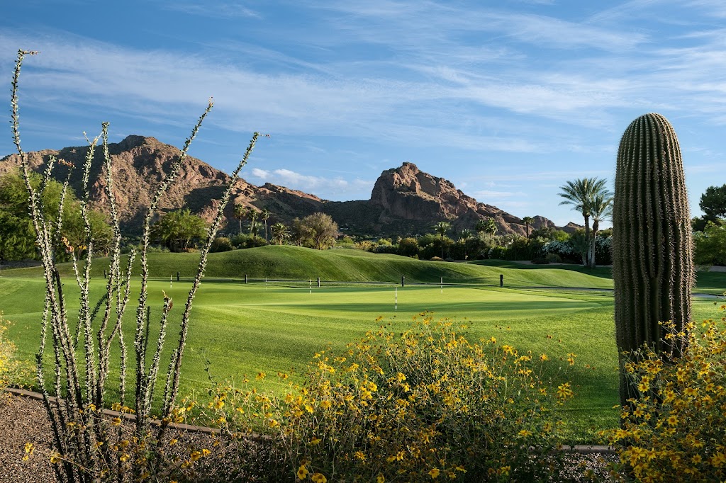 Panoramic view of a lush green golf course at The Short Course at Mountain Shadows. Smooth