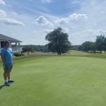 green grass with the flag in the hole.