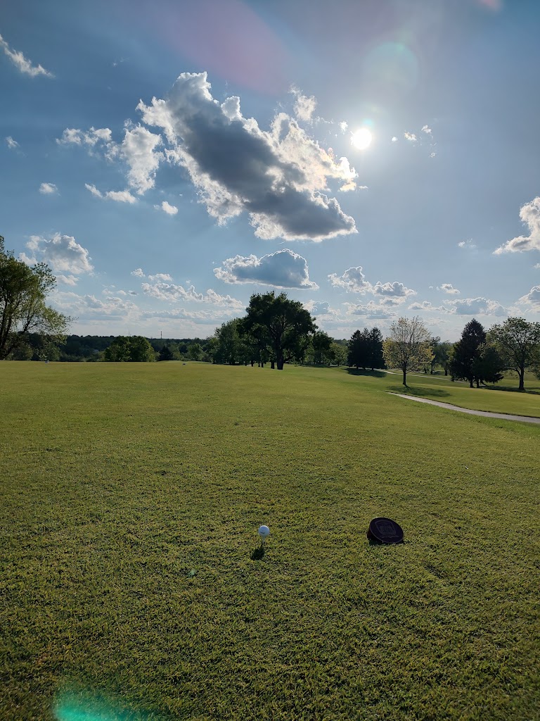 Panoramic view of a lush green golf course at The University Club at Arlington. Smooth