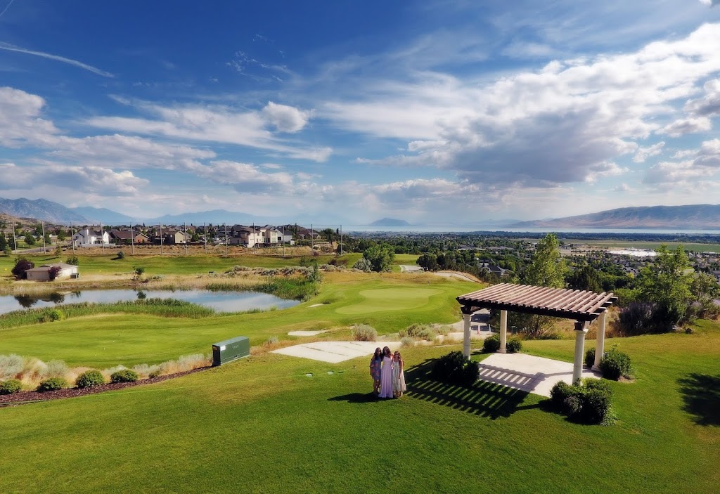 Panoramic view of a lush green golf course at The Vista at Cedar Hills Golf Club. Smooth