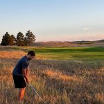 Panoramic view of a lush green golf course at Thedford Golf Course. Smooth