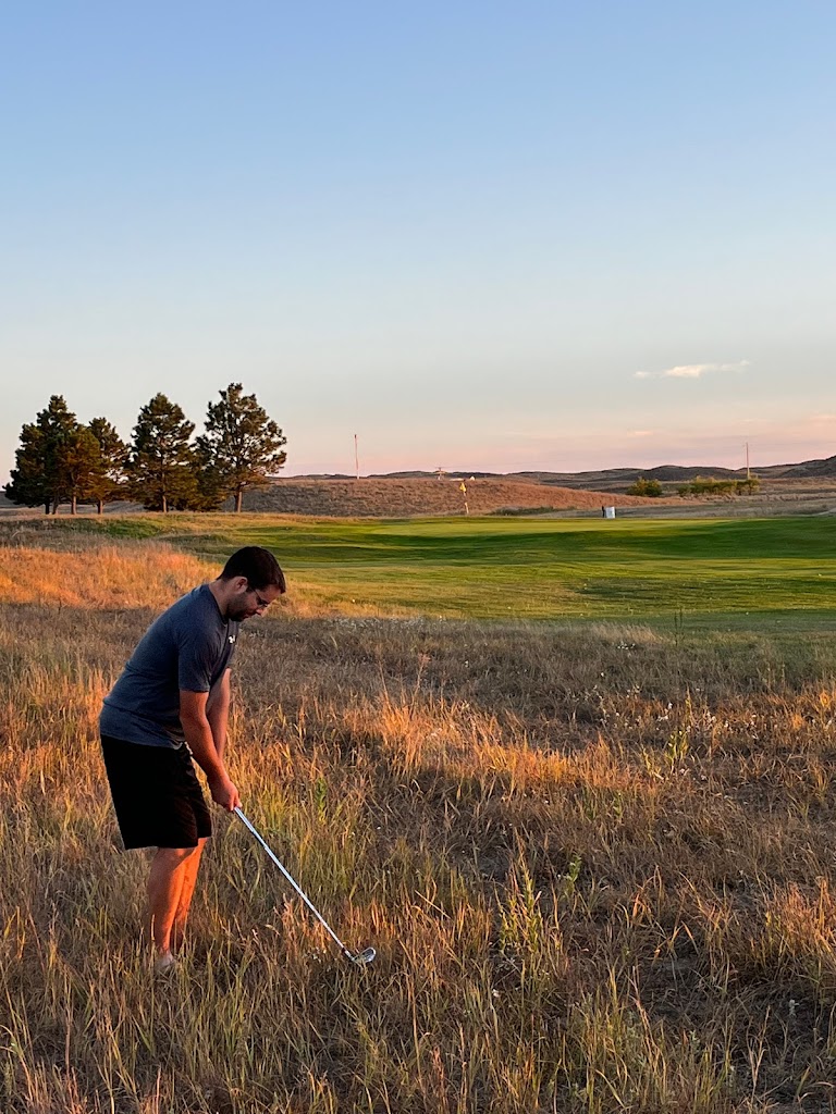 Panoramic view of a lush green golf course at Thedford Golf Course. Smooth