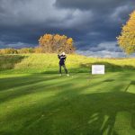 green grass with the flag in the hole.