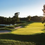 Panoramic view of a lush green golf course at Thornapple Pointe Golf Club. Smooth