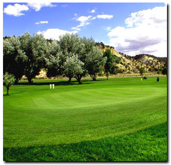 Panoramic view of a lush green golf course at Thunderbird Golf Course. Smooth