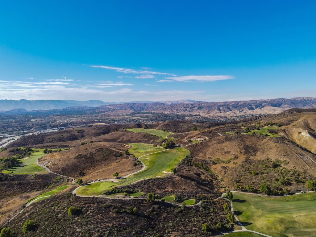 Panoramic view of a lush green golf course at Tierra Rejada Golf Club. Smooth