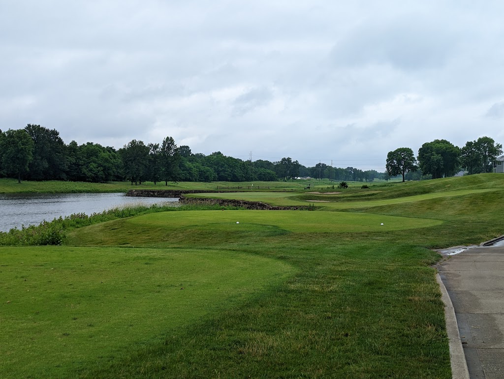 Panoramic view of a lush green golf course at Tiffany Greens Golf Club. Smooth