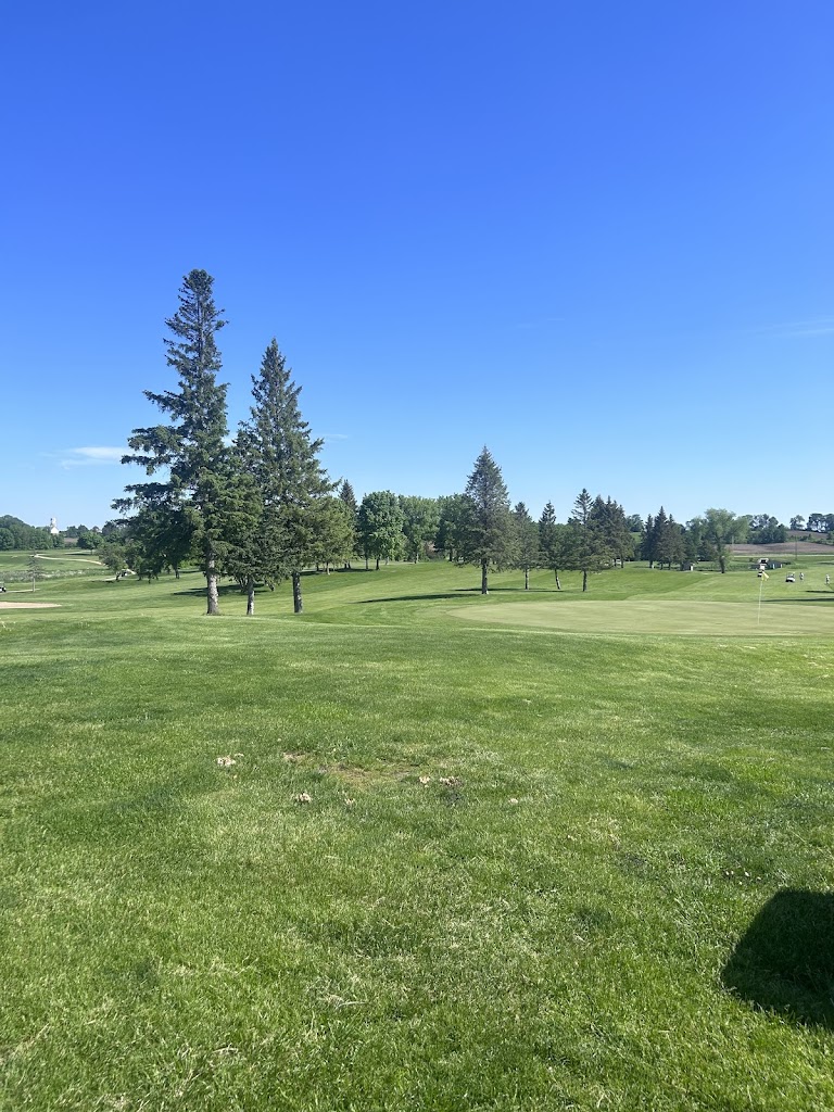 Panoramic view of a lush green golf course at Timber Creek Golf Course. Smooth