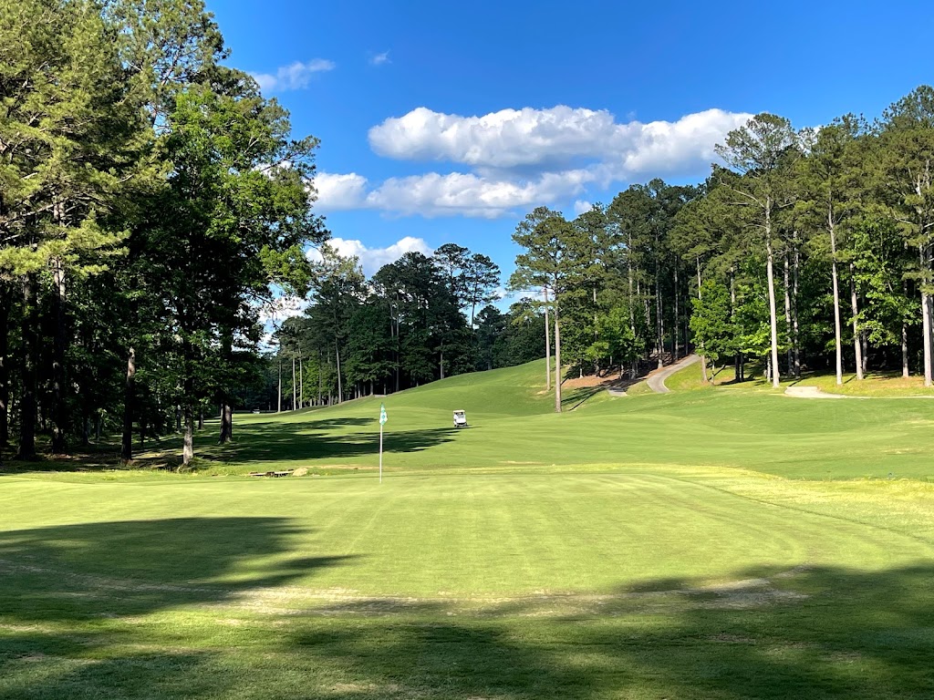 Panoramic view of a lush green golf course at Timberline Golf Club. Smooth