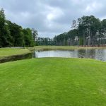 Panoramic view of a lush green golf course at Timberton Golf Club. Smooth