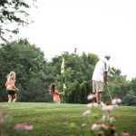 Panoramic view of a lush green golf course at Toad Valley Golf Course. Smooth