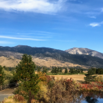 Panoramic view of a lush green golf course at Toiyabe Golf Club. Smooth