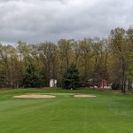 Panoramic view of a lush green golf course at Topstone Golf Course. Smooth