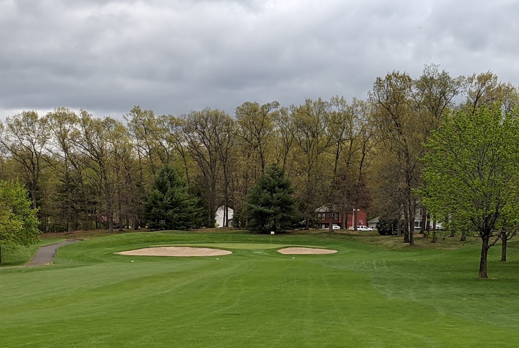 Panoramic view of a lush green golf course at Topstone Golf Course. Smooth