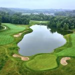 Panoramic view of a lush green golf course at Tournament Club of Iowa. Smooth