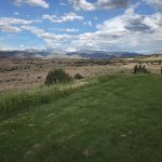 Panoramic view of a lush green golf course at Towa Golf Club. Smooth