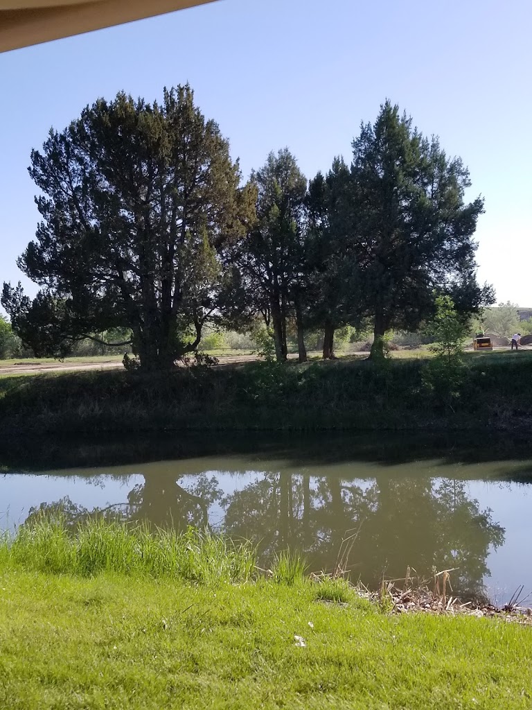 Panoramic view of a lush green golf course at Trail Ruts Golf Course. Smooth