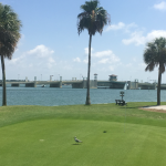 Panoramic view of a lush green golf course at Treasure Bay Golf & Tennis. Smooth