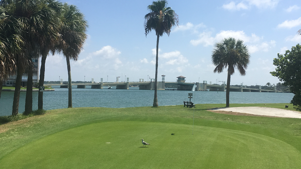 Panoramic view of a lush green golf course at Treasure Bay Golf & Tennis. Smooth