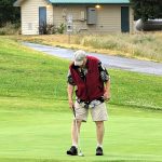 green grass with the flag in the hole.