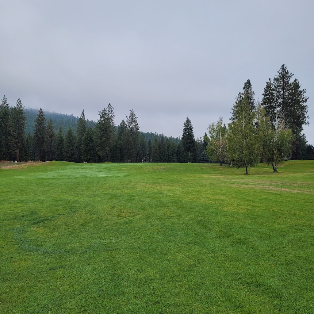 Panoramic view of a lush green golf course at Trestle Creek Golf Course. Smooth