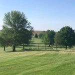 Panoramic view of a lush green golf course at Treynor Recreation Area. Smooth