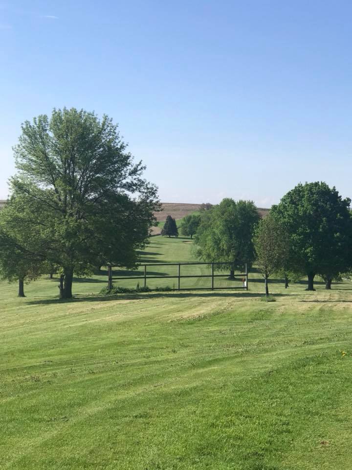 Panoramic view of a lush green golf course at Treynor Recreation Area. Smooth