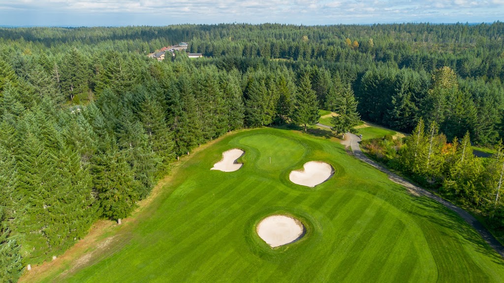 Panoramic view of a lush green golf course at Trophy Lake Golf & Casting. Smooth