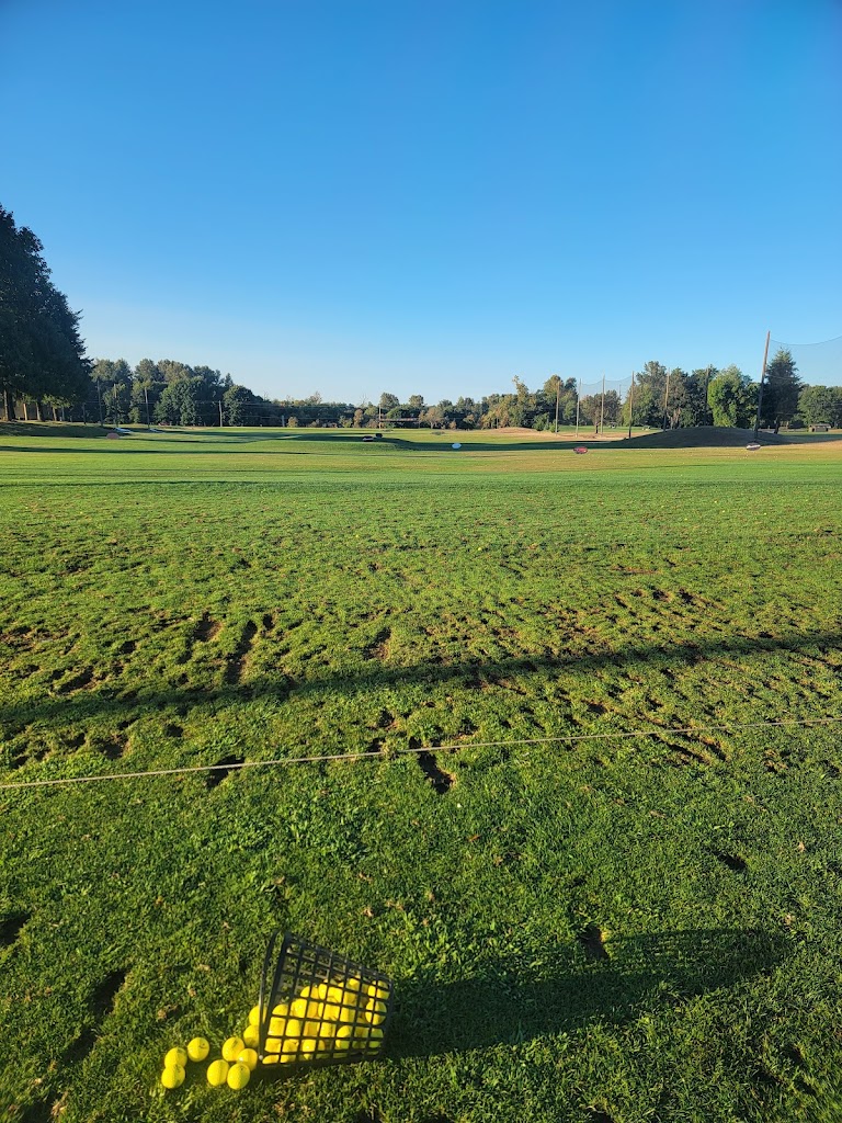 Panoramic view of a lush green golf course at Trysting Tree Golf Club. Smooth