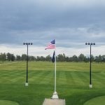 Panoramic view of a lush green golf course at Tulare Golf Course. Smooth