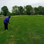 green grass with the flag in the hole.