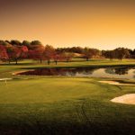 Panoramic view of a lush green golf course at Turf Valley Golf Club. Smooth