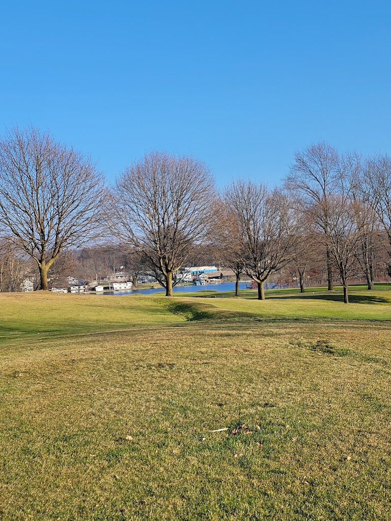 Panoramic view of a lush green golf course at Turkeyfoot Golf Course Maintenance. Smooth