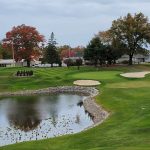 Panoramic view of a lush green golf course at Turkeyfoot Lake Golf Links. Smooth