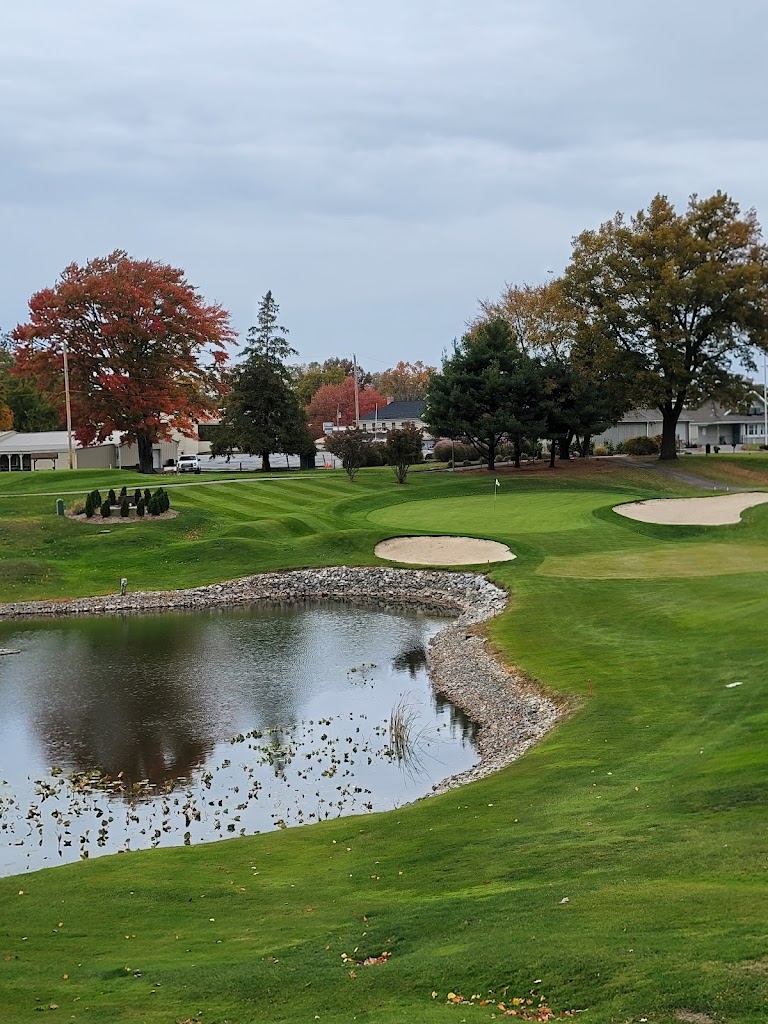 Panoramic view of a lush green golf course at Turkeyfoot Lake Golf Links. Smooth