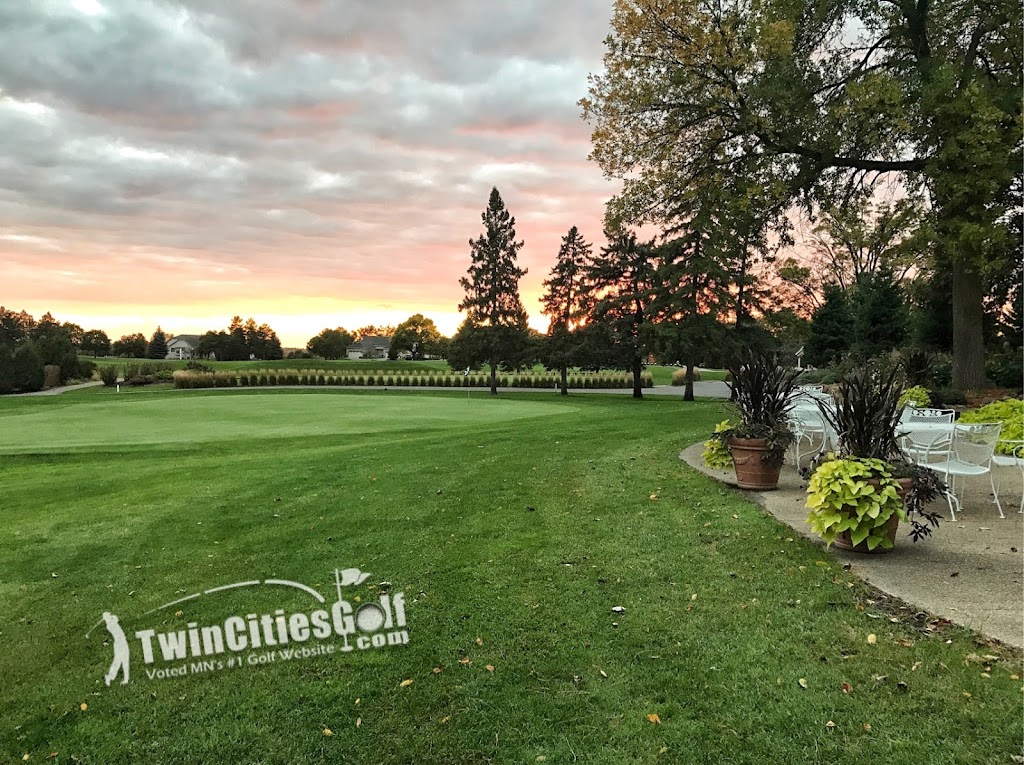 Panoramic view of a lush green golf course at TwinCitiesGolf.com. Smooth