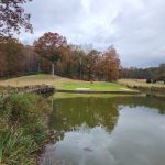 Panoramic view of a lush green golf course at University Golf Course. Smooth