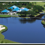 Panoramic view of a lush green golf course at University Park Country Club. Smooth