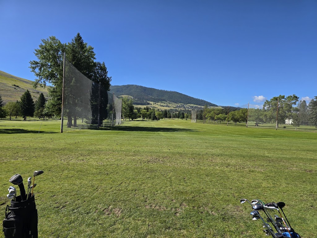 Panoramic view of a lush green golf course at University of Montana Golf Course. Smooth