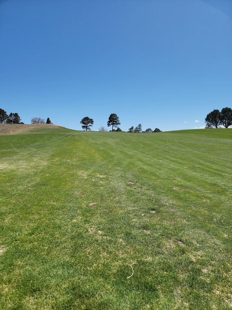 Panoramic view of a lush green golf course at University of New Mexico. Smooth