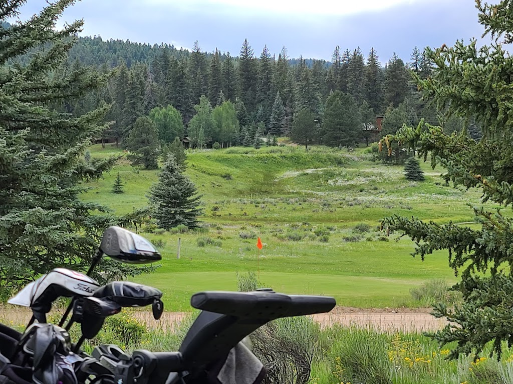 Panoramic view of a lush green golf course at Valle Escondido Golf Course. Smooth