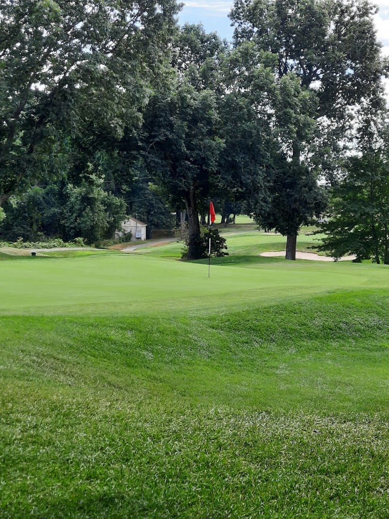 Panoramic view of a lush green golf course at Valley Country Club. Smooth