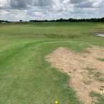 Panoramic view of a lush green golf course at Valley Point Golf Course. Smooth