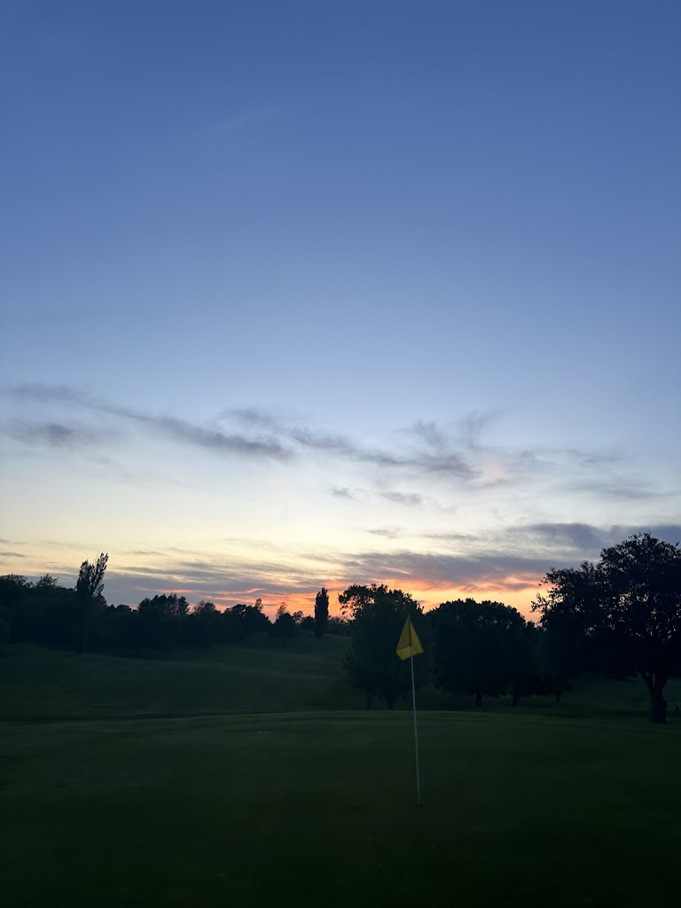 Panoramic view of a lush green golf course at Valley View Golf Course. Smooth