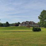 Panoramic view of a lush green golf course at Valleywood Golf Club. Smooth