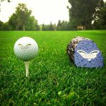 Panoramic view of a lush green golf course at Vardon Golf Club. Smooth